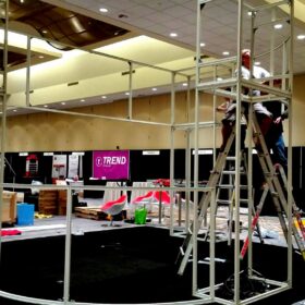 Installers building tradeshow display frame